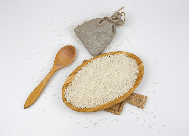 basmati rice groats in a wooden bowl