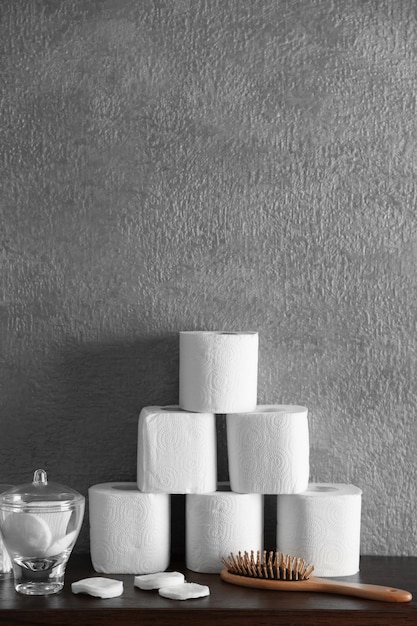 Bath accessories on grey wall background