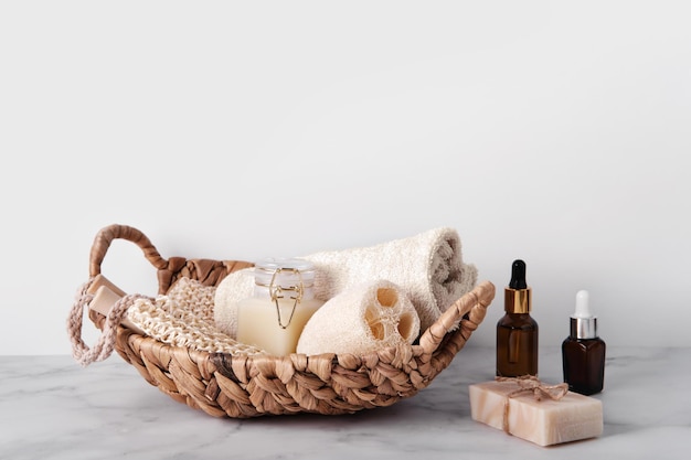 Bath accessories set in wicker basket Sustainable personal hygiene items copy space