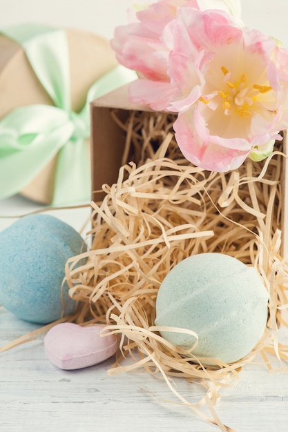 Bath bombs on white wooden background