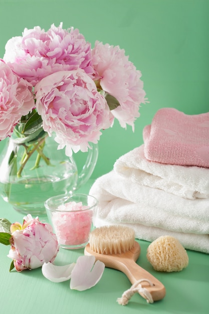 Bath and spa with peony flowers brush sponge towels