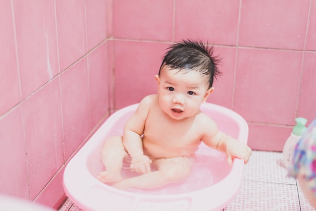 Bath time for a cute little baby