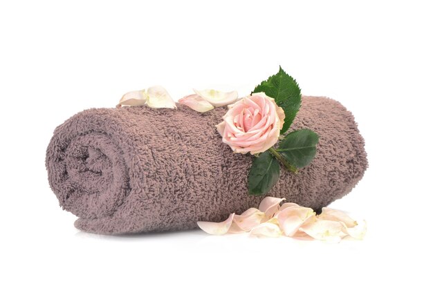 Bath towel with rose isolated on white