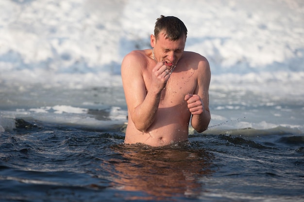 Bathing in the ice hole. Plunge into the ice water