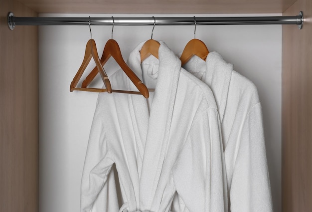 Bathrobes hanging in wardrobe