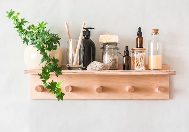 Photo bathroom cozy interior wooden shelfhanger with accessories for skin care and beauty on a light background