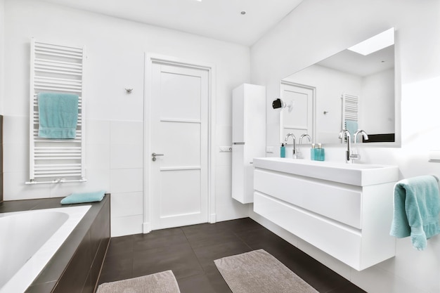 The bathroom is in a minimalist style with a white chest of drawers