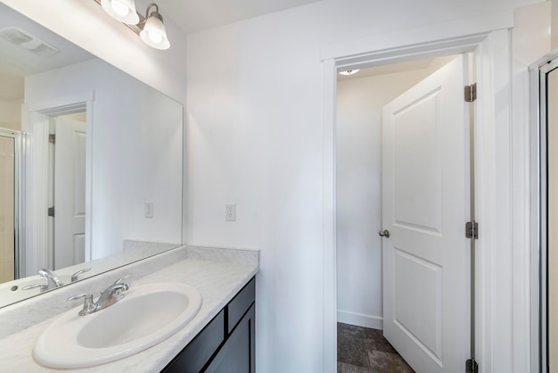 Bathroom of a modern apartment with white furniture