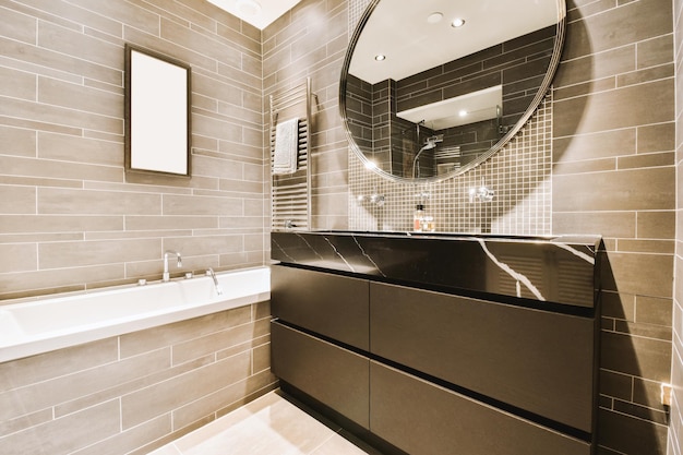 A bathroom with a large mirror and a bath tub