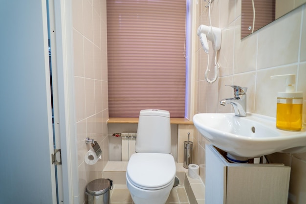 A bathroom with a toilet and a sink in it