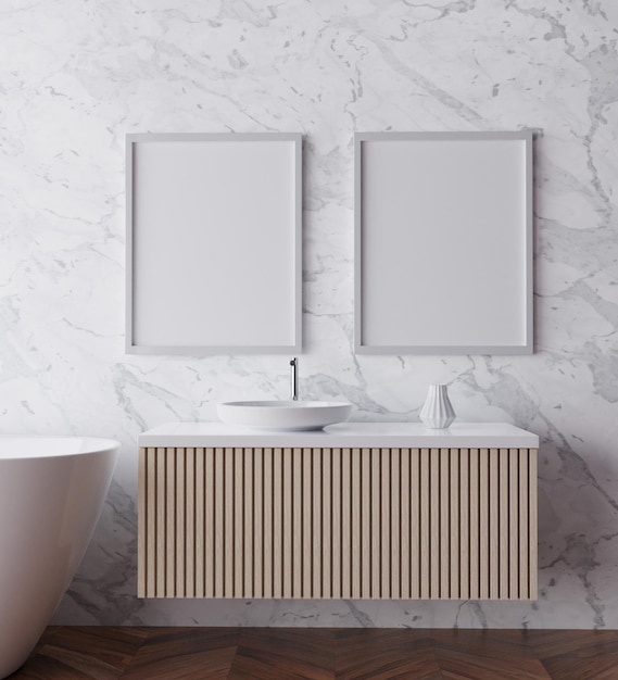 A bathroom with two framed white frames on the wall.