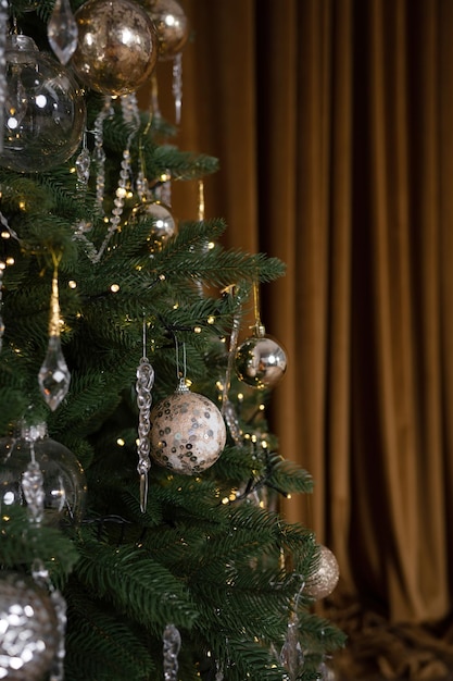 Battered ball hanging on the Christmas tree, close-up