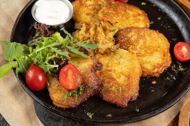 battered seafood in a pan on a black background