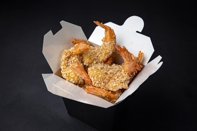 battered shrimp on a dark background