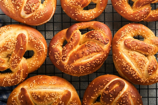 Bavarian pretzels Oktoberfest food menu traditional salted pretzels over old dark wooden background Top view with space for text Oktoberfest theme