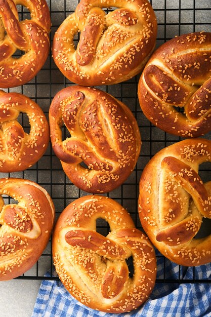 Bavarian pretzels Oktoberfest food menu traditional salted pretzels over old dark wooden background Top view with space for text Oktoberfest theme