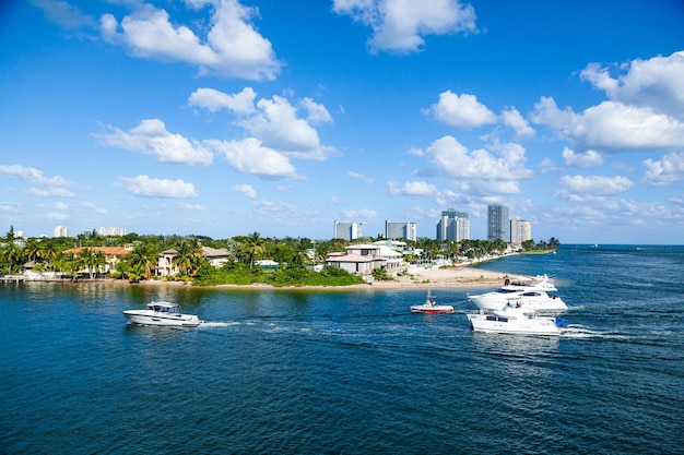 Bay and coastline in clear sunny weather with luxury homes and yachts in Fort Lauderdale Florida USA