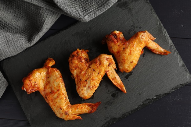 Bbq buffalo wings Fried chicken on a dark background delicious grilled chicken wings