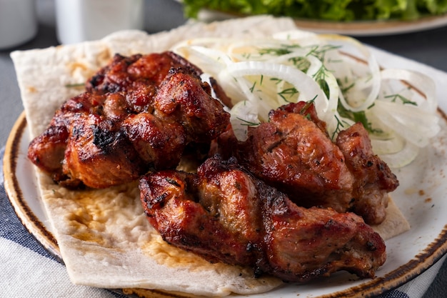 Bbq pork meat pieces on a plate