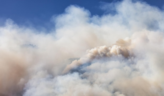 BC Forest Fire and Smoke over the mountain near Hope during a hot sunny summer day