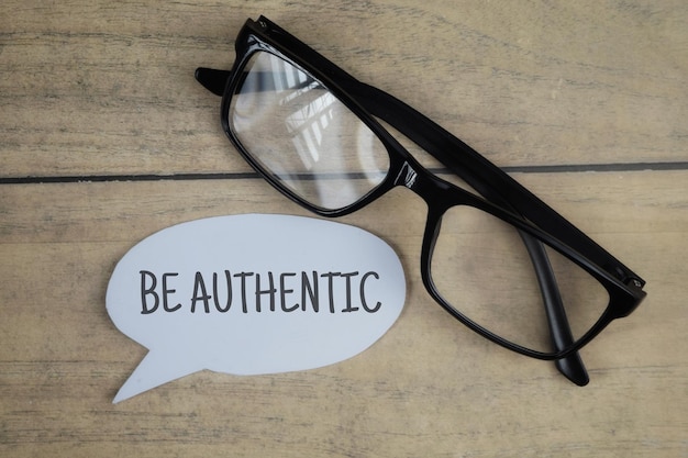 Be Authentic wording with glasses.