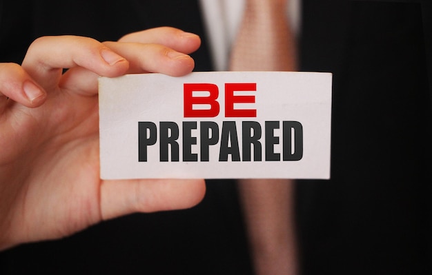 BE PREPARED message on business card shown by a businessman Business startup risks management concept