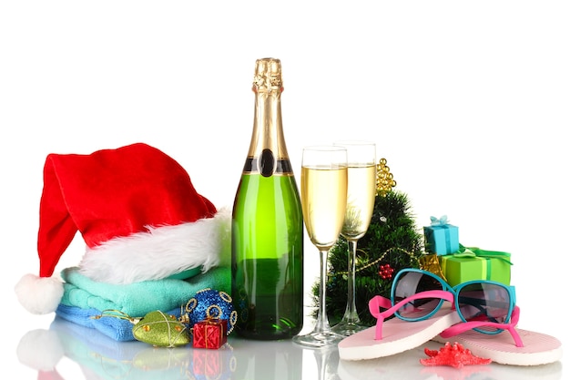 Beach accessories champagne and Christmas tree isolated on white