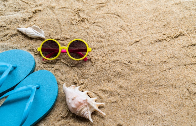 Beach Accessories On Table On Beach - Summer Holidays