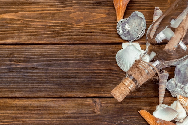 Beach accessories on wooden board background