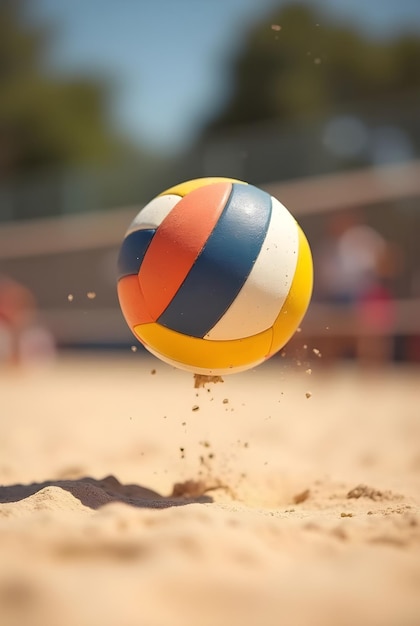 Photo a beach ball is in the sand and the sand is in the air