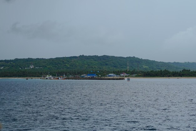 A beach and a boat in the distance