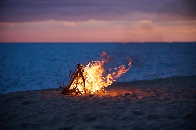 Beach Bonfire selective focus with Beautiful Sunset or sunrise nobody