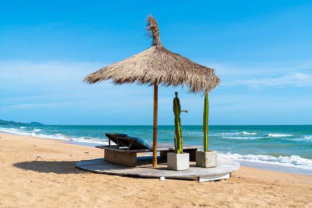 Beach chair and umbrella with sea beach background