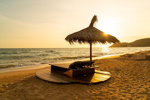 Beach chair and umbrella with sea beach background