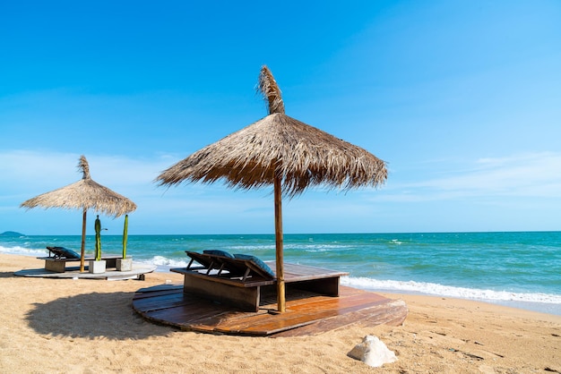 Beach chair and umbrella with sea beach background