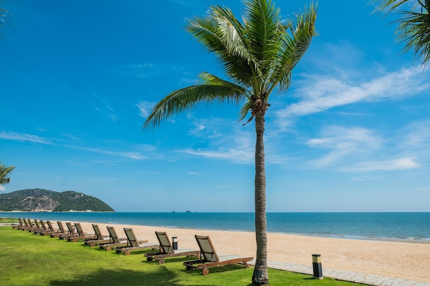 Beach chair with white sand and blue sky