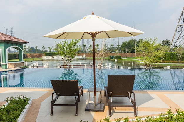 Beach chairs side swimming pool at Thailand