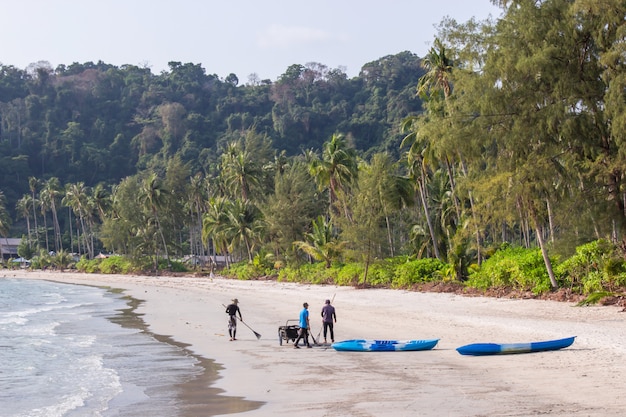 Beach cleaning staff group on the area ao prao at koh kood island, Trat Province Thailand.