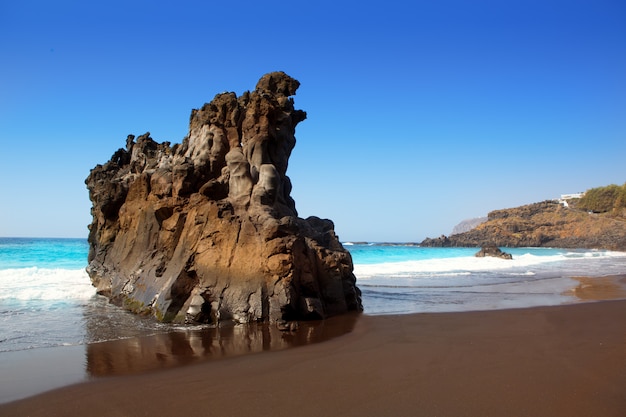 Beach el Bollullo black brown sand and aqua water