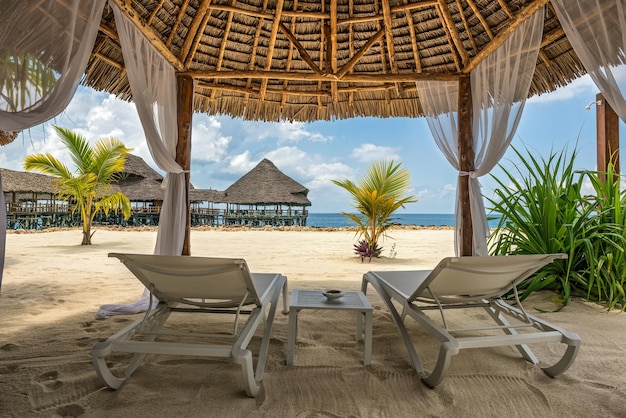 Beach lounges and a beach bar Zanzibar Tanzania