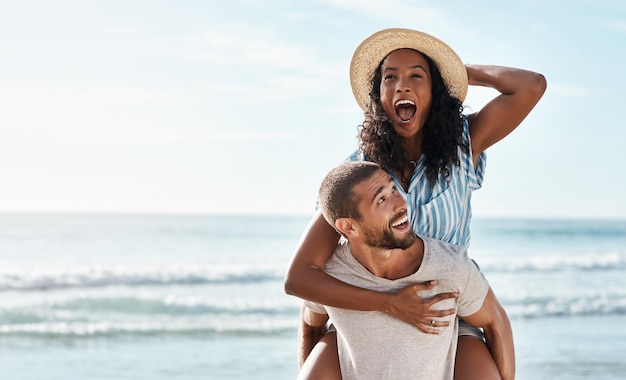 Beach piggy back and woman with happy man on romantic summer holiday with mockup space and travel to ocean Romance happiness and excited couple at sea for adventure on vacation together in Cancun