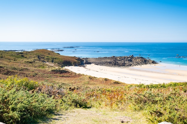 Beach Pit on Breton coastline in France Frehel Cape region with its sand, rocks and moorland in summer.