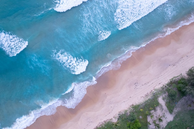 Beach Sand Sea Shore and waves white foamy summer sunny day