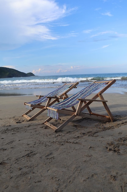 a beach scene with a blue beach towel that says  beach lounge