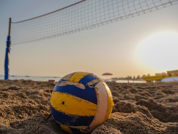 Beach volleyball at sunset on the beach