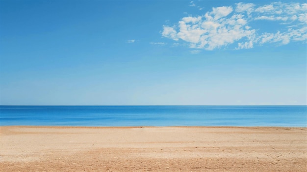 a beach with a blue sea and a sky with clouds