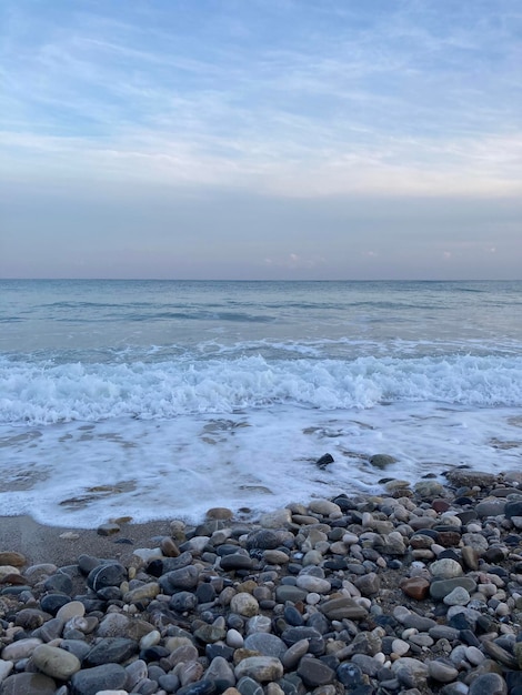 A beach with a blue sky and a few clouds