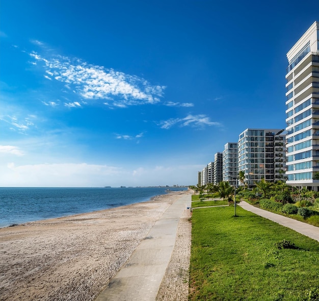 a beach with a building on the right side and a beach in the background