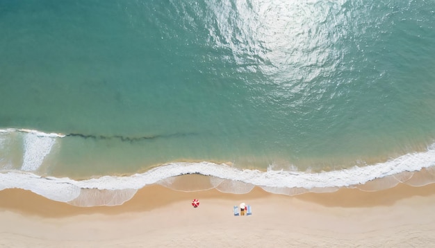 a beach with a person on the sand and a surfboard in the water