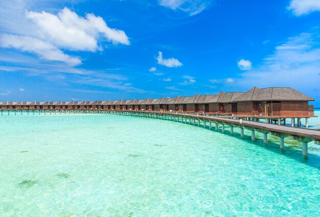 Beach with water bungalows at Maldives